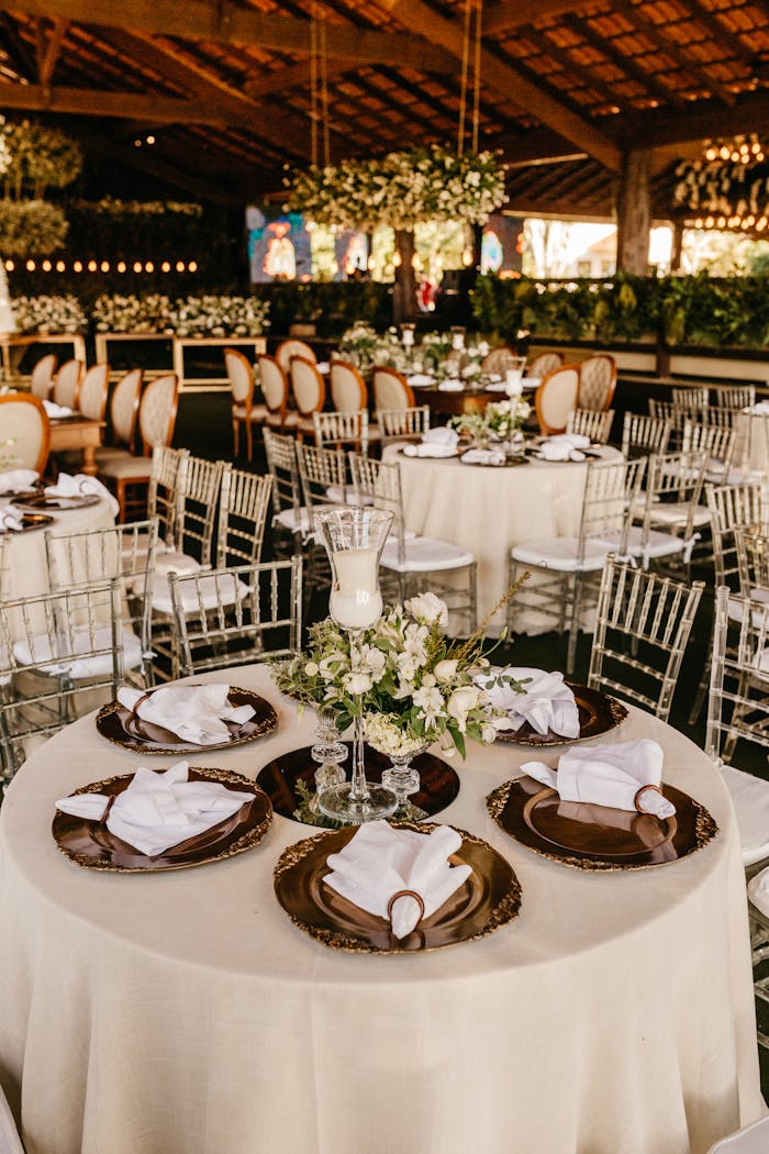 Beautifully arranged wedding reception with elegant table settings and floral decorations.